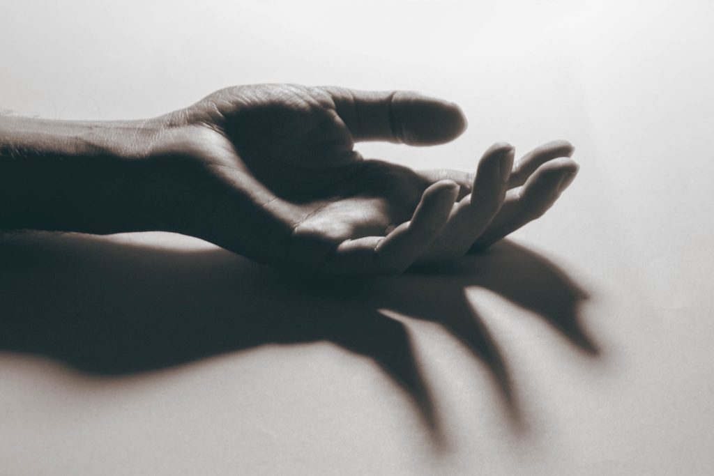 Black and white closeup of a human hand