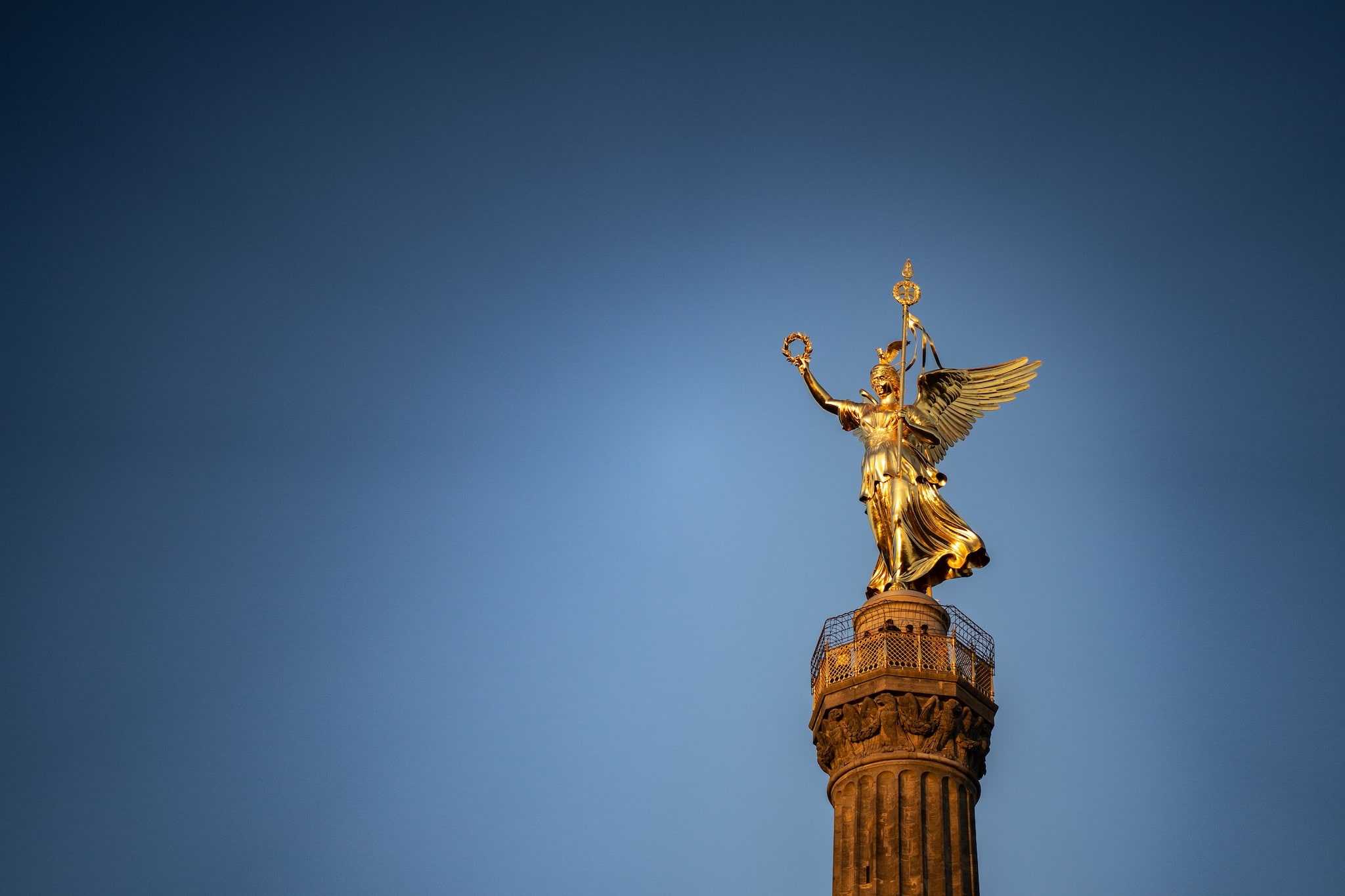 A closeup view of a statue atop the Victory Column in Tiergarten