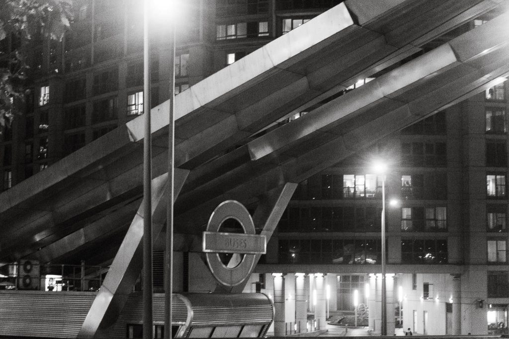 Black and white photo of London Vauxhall bus stop at night